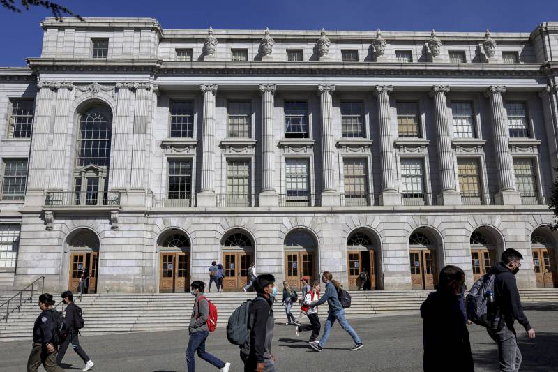 People walk by Wheeler Hall on the UC Berkeley campus on March 14, 2022 in Berkeley, California.