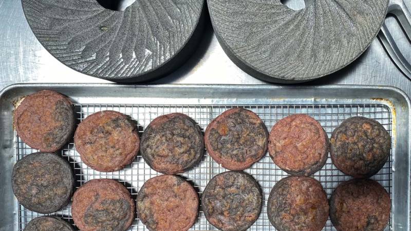 handmade tortillas using purple masa are prepared on a countertop