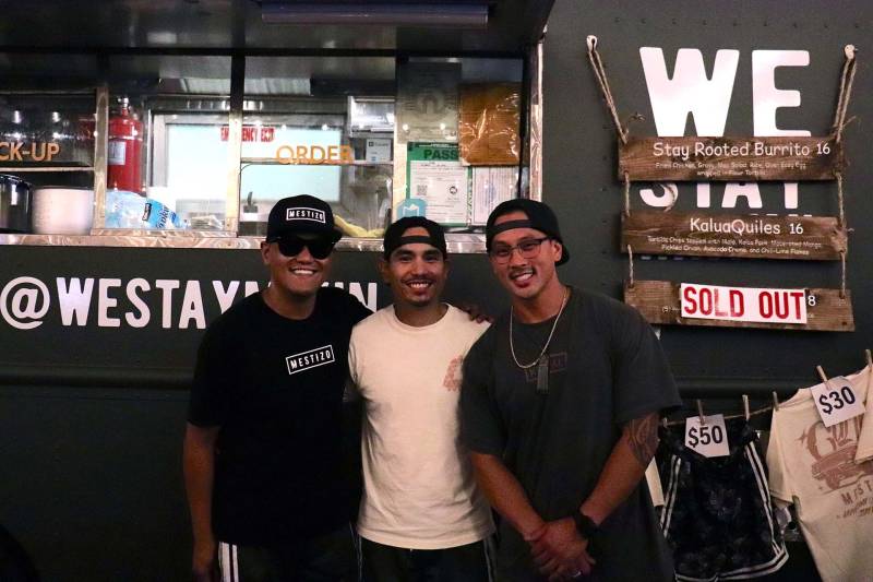 a group of three friends stand in front of their new food truck in San Jose