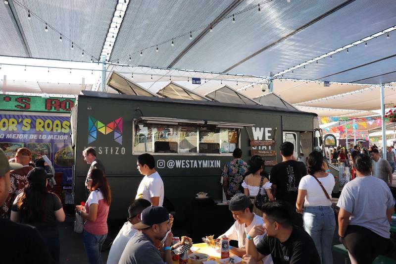 a crowd gathers in front of a food truck in San Jose